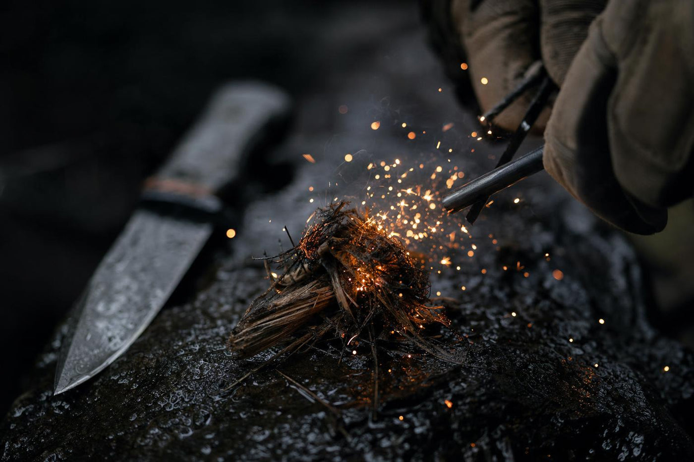 ferro rod fire starter sparking into tinder in wet survival conditions