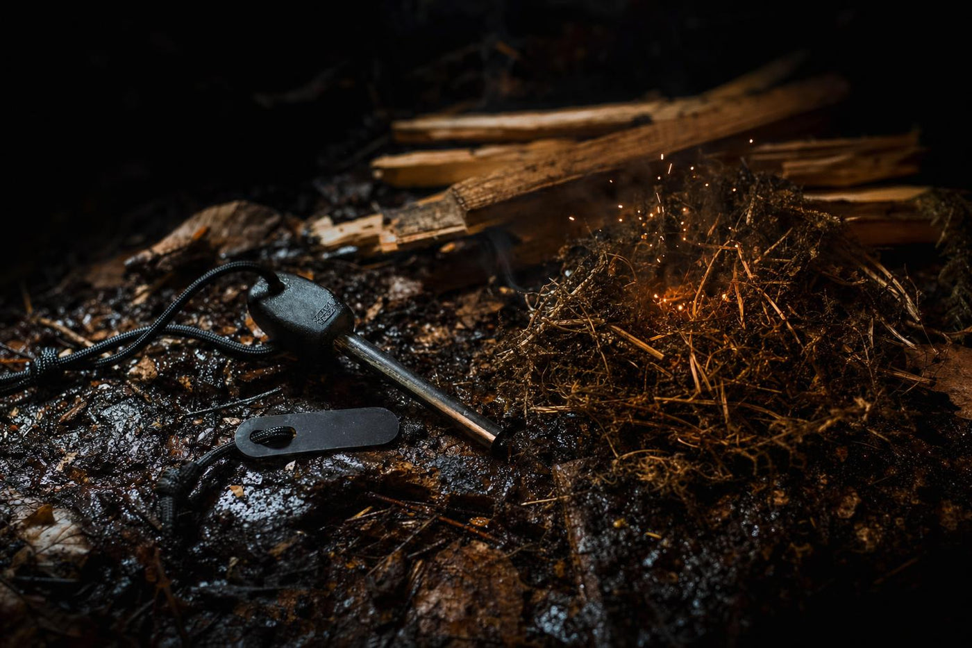 ferro rod and prepared tinder nest for survival fire starting in wet conditions