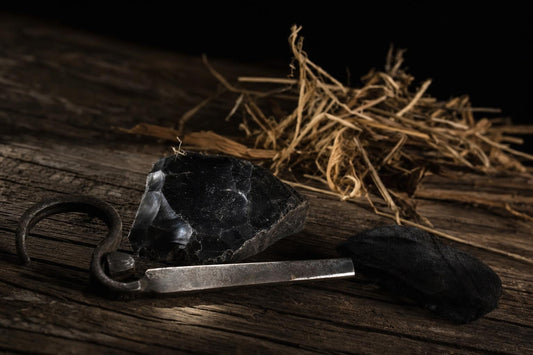 flint and steel fire kit with char cloth and natural tinder bundle