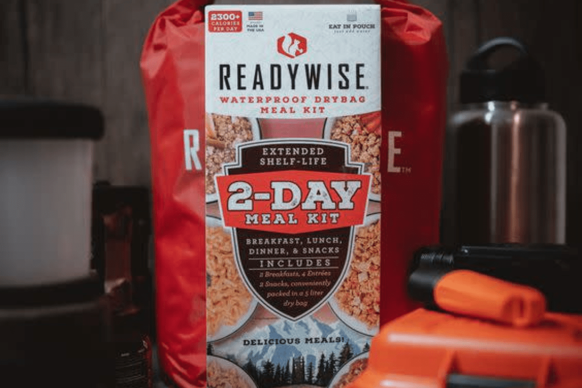 a bag of readywise 2 - day food sits on a table next to tools