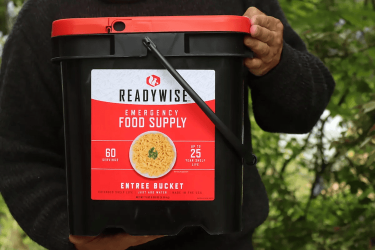 man holding ready wise food supply bucket