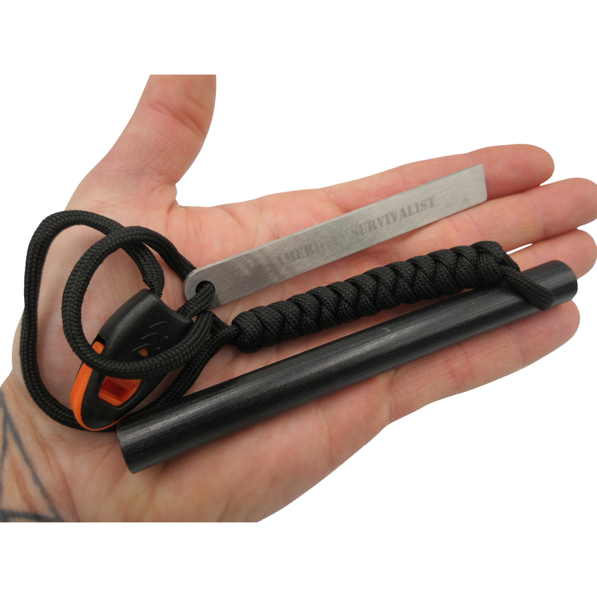 Black American Survivalist ferro rod and striker held in a hand to show the 5-inch size